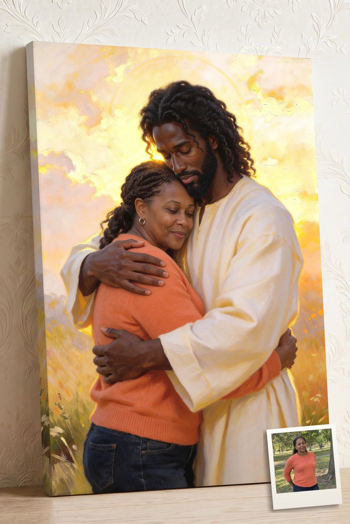 Personalized Black Jesus canvas of a woman held in Jesus’ arms, His head bowed with love, with a small print of her original photo