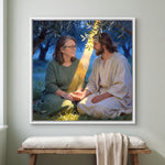 Personalized Jesus canvas of a woman sitting with Jesus beneath an olive tree, hands joined, in a White floating frame